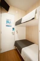 FAST SLEEP Guarulhos by Slaviero Hotéis客房内的一张或多张床位