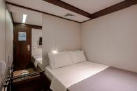 FAST SLEEP Guarulhos by Slaviero Hotéis客房内的一张或多张床位