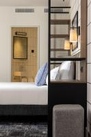 Hôtel Moderniste客房内的一张或多张床位