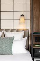 Hôtel Moderniste客房内的一张或多张床位