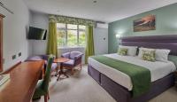 Best Western Moores Central Hotel客房内的一张或多张床位