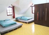 NHỚ House IV客房内的一张或多张床位