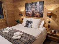 Chalet neuf 14 pers proximit&eacute; La Clusaz et Grand Bornand&#x5BA2;&#x623F;&#x5185;&#x7684;&#x4E00;&#x5F20;&#x6216;&#x591A;&#x5F20;&#x5E8A;&#x4F4D;