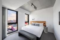 Nesuto Docklands客房内的一张或多张床位