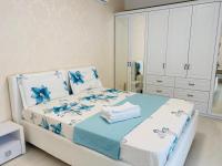 Apartament lux客房内的一张或多张床位