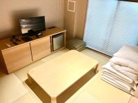 Guest One More Heart at Higashi Otowa客房内的一张或多张床位