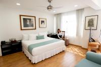 Suites Coben Apartamentos Amueblados客房内的一张或多张床位