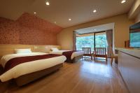 鬼怒川日光酒店(Hotel Sunshine Kinugawa)客房内的一张或多张床位