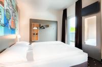 B&B Hotel Stuttgart-Neckarhafen客房内的一张或多张床位