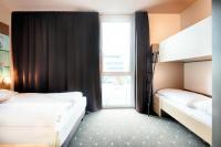B&B Hotel Stuttgart-Neckarhafen客房内的一张或多张床位