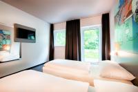 B&B Hotel Stuttgart-Neckarhafen客房内的一张或多张床位