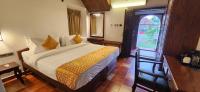 Kumarakom Tharavadu - A Heritage Hotel, Kumarakom客房内的一张或多张床位