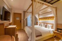 Yoba Boutique Hotel客房内的一张或多张床位