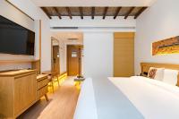 Yoba Boutique Hotel客房内的一张或多张床位