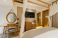 Yoba Boutique Hotel客房内的一张或多张床位