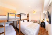 QuintessaHotel KagoshimaTenmonkan Relax&Sleep客房内的一张或多张床位