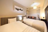 QuintessaHotel KagoshimaTenmonkan Relax&Sleep客房内的一张或多张床位