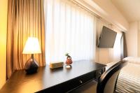 QuintessaHotel KagoshimaTenmonkan Relax&Sleep的电视和/或娱乐中心