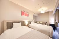 QuintessaHotel KagoshimaTenmonkan Relax&Sleep客房内的一张或多张床位