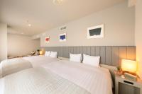 QuintessaHotel KagoshimaTenmonkan Relax&Sleep客房内的一张或多张床位