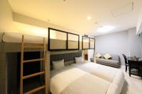 QuintessaHotel KagoshimaTenmonkan Relax&Sleep客房内的一张或多张床位