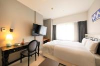 QuintessaHotel KagoshimaTenmonkan Relax&Sleep客房内的一张或多张床位