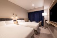 Hotel Keihan Nagoya客房内的一张或多张床位