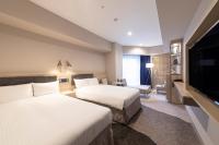 Hotel Keihan Nagoya客房内的一张或多张床位