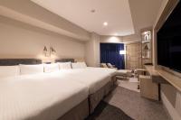 Hotel Keihan Nagoya客房内的一张或多张床位