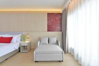 Centre Point Plus Hotel Pratunam客房内的一张或多张床位
