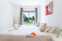 #154 V2 Vila Branca 54 by Home Holidays客房内的一张或多张床位