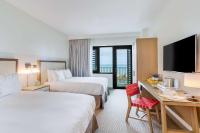 The Lodge at Gulf State Park, A Hilton Hotel客房内的一张或多张床位