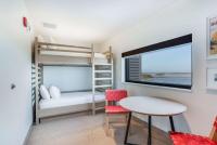 The Lodge at Gulf State Park, A Hilton Hotel客房内的一张或多张床位