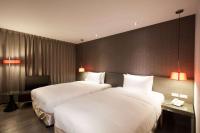 Ramada Encore By Wyndham Hualien客房内的一张或多张床位