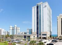 默特尔比奇Hilton Grand Vacations Club Ocean 22 Myrtle Beach的城市中一座高层建筑的效果图