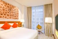 Grand Mercure Dubai City客房内的一张或多张床位