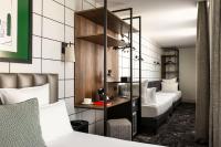 Hôtel Moderniste客房内的一张或多张床位