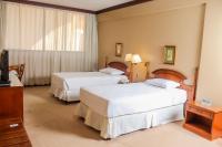 Nobile Suites Excelsior Asuncion客房内的一张或多张床位