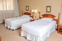 Nobile Suites Excelsior Asuncion客房内的一张或多张床位