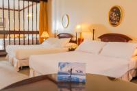 Nobile Suites Excelsior Asuncion客房内的一张或多张床位
