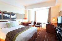 International Resort Hotel Yurakujo客房内的一张或多张床位