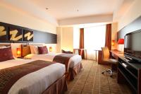 International Resort Hotel Yurakujo客房内的一张或多张床位