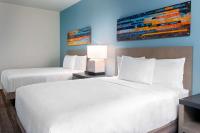 Hyatt House Orlando Airport客房内的一张或多张床位