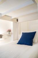 Qilombo Hostel Silom - HQ客房内的一张或多张床位