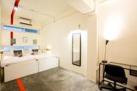 Qilombo Hostel Silom - HQ客房内的一张或多张床位