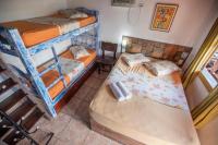 Pousada Casa do Rio Hostel - 8 min do Centro Hístorico - Passeio de Barco com saída da Pousada -Pago a parte- Perto das Praias e Beira Rio客房内的一张或多张床位