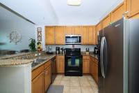 Marvelous 9th Floor Condo Gulf, Pool &amp; Sunset View的厨房或小厨房