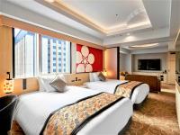 Daiwa Roynet Hotel KANAZAWA-MIYABI客房内的一张或多张床位