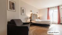Hôtel l'Arena客房内的一张或多张床位