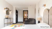 Hôtel l'Arena客房内的一张或多张床位